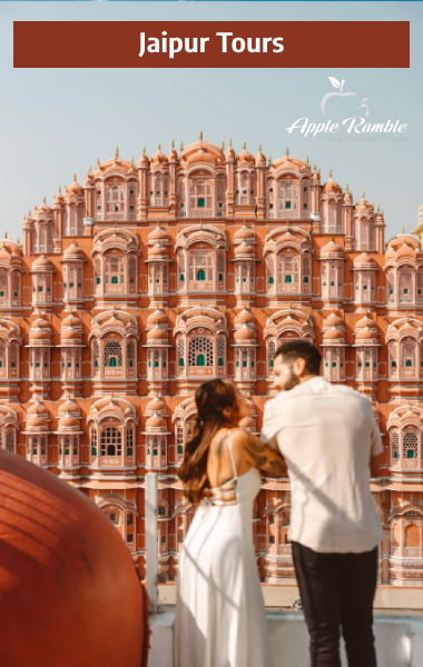 Couple admiring the iconic Hawa Mahal facade during a romantic Jaipur city tour organized by Apple Ramble Tour & Travels.